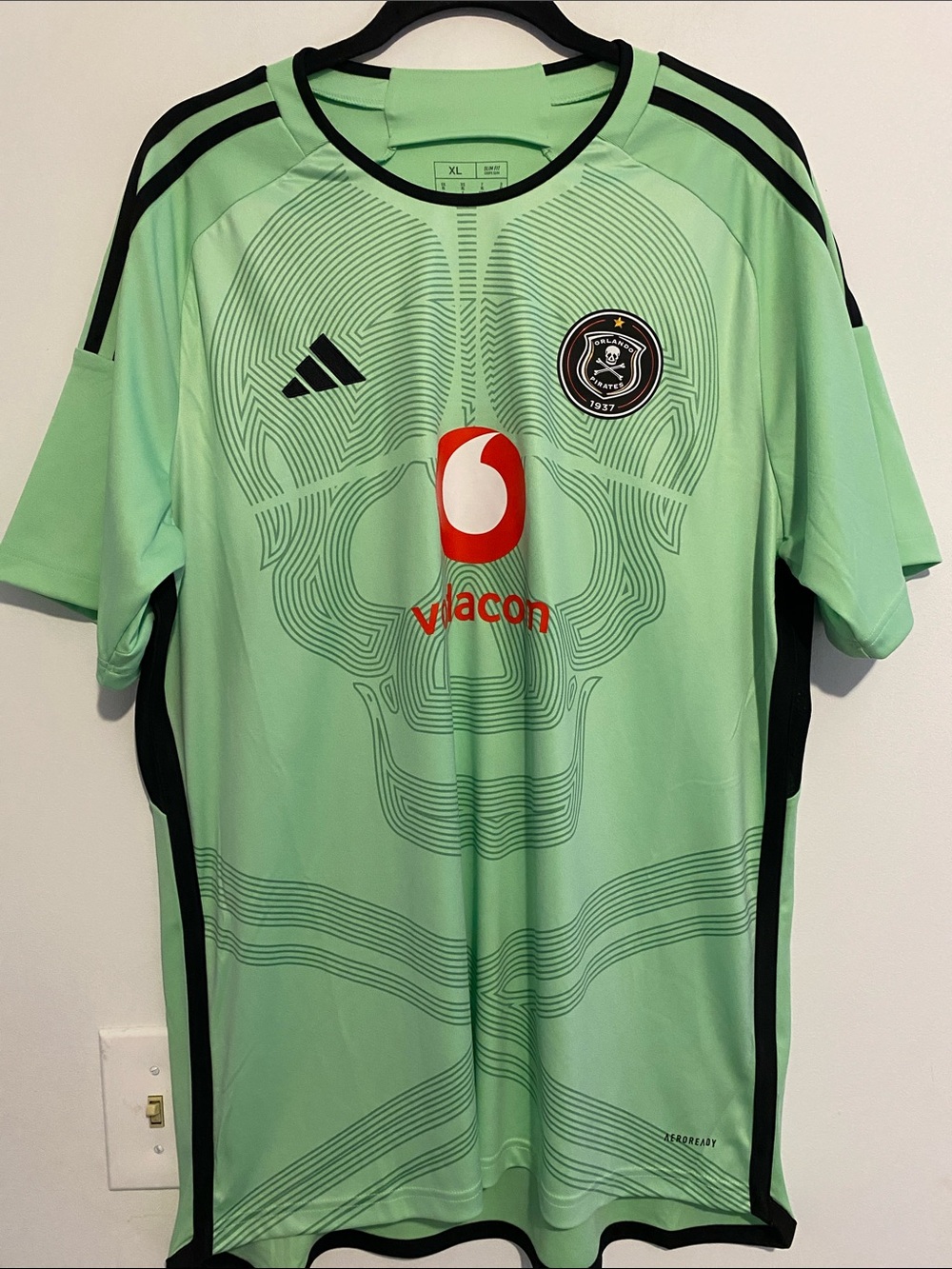 adidas Men’s Mint Green Orlando Pirates Jersey with Black Trim and Skull Graphic